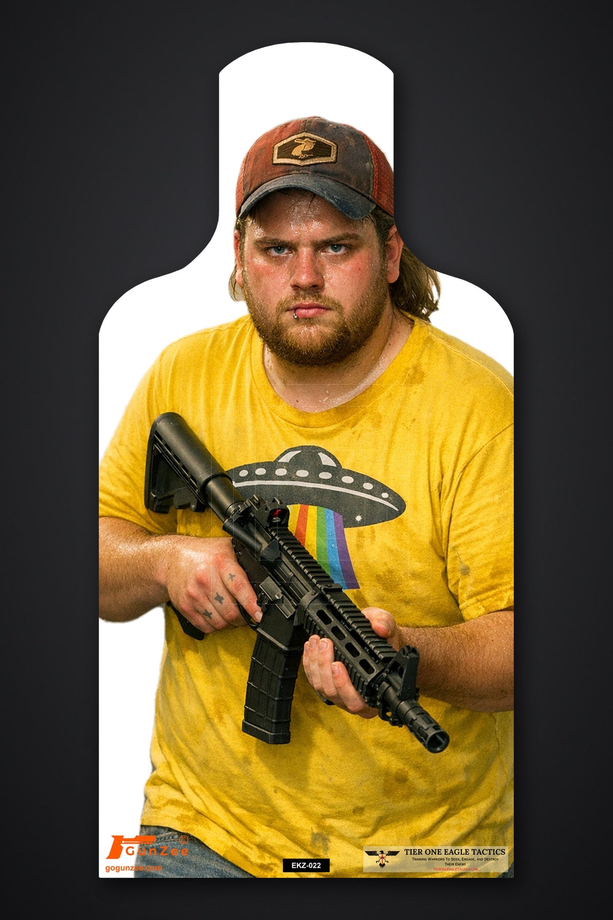 Life-size E-type silhouette target: heavyset bearded man in a trucker cap and yellow graphic t-shirt holding a carbine at low ready