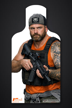 Life-size E-type silhouette target: bearded man in a gray cap and black tactical vest holding a carbine with a red dot sight at low ready