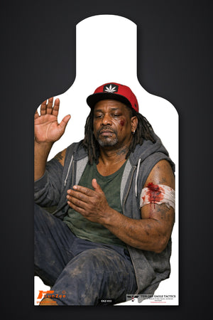 E-type silhouette no-shoot target: man seated on the ground in a red cap with a bandaged, bleeding arm and one hand raised