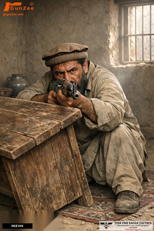 Male suspect in a rustic room aiming an AK-pattern rifle from behind a table, intense expression.