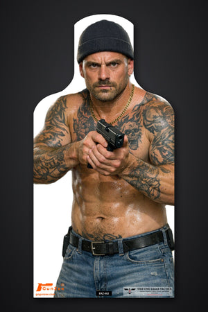 Life-size E-type silhouette target: shirtless tattooed man in a dark beanie holding a pistol at chest level with both hands